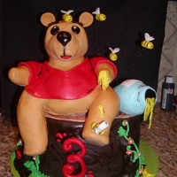 Whinnie The Pooh for my daughter's 3rd birthday! Pooh is rice crispy covered in fondant. Cake is 3 layer, 10 inch, apple spice cake with cream cheese...