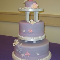 1St Birthday Cake Lemon cake with raspberry filling covered in purple fondant. Decorated with gumpaste and royal icing butterflies. Almost all of it was...