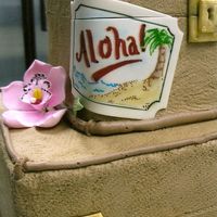 Suitcase Bridal Shower A bride planning a Hawaii-themed wedding requested two stacked suitcase cakes with a tropical theme for her bridal shower. It's...