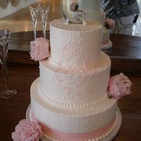 Peony Cake The stylized peony was piped on in pink to match the couple's invitations.
