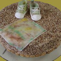 Camo Baby Shoes Italian cream cake, with gumpaste baby shoes & blanket. The theme was camo/hunting