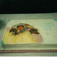 A Dream Come True The baby is actually wrapping paper that I laminated. The yellow and pink blanket is icing which I imitated from the blanket on the...