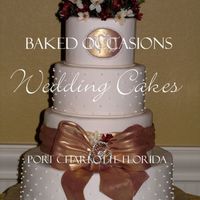 Brittany's Bow & Broach My Bride brought a picture from a wedding magazine ad. The flowers on top are silk found by the bride and a real broach. The bow is fondant...