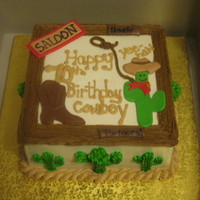 Cowboy West Theme Bday This cake is iced and filled in bc. The frame is BC the cactus, boot, and signs are all MMF writing on the signs was done with an edible...