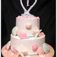 Beach-Themed Shower Cake Sea-shells brushed with luster dust, sand made of crushed graham crackers.