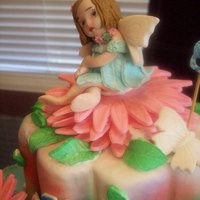 Fairy "Fairy themed cake for my 8th yr. old niece. Fairy shaped from gumpaste, saw the article here in CakeCentral 'bout how to make a...