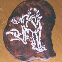 Fondant Stamped Horse This was an idea I had and wanted to play with. I stamped white fondant and then painted the rest brown. It looks kind of like leather.