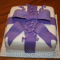 Purple Ribbon This is my first attempt at fondant. Wish it tasted as good as it looks! I think I'm going to really like working with fondant and...