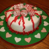 Christmas Is Love This is my Fondant & Gumpaste graduation cake which came just in time for Christmas. White cake, white BC icing and white fondant....
