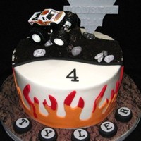 Monster Jam! Composite of several different ideas. Buttercream with 50/50 accents. Dirt road is crushed oreos, and the truck is a real toy that went to...