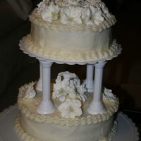 Cream Cheese Lily Cake RI lilies and cream cheese frosting. top tier is homemade WASC cake with strawberry filling. Bottom tier is storebought Red velvet cake......