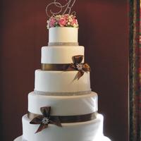 Daughters Wedding Cake This was for my dd's wedding cake. All fondant with gumpaste sugar flowers to resemble her bouquet. Swarovski broaches and monogram...