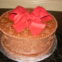 Red Bow Simple red bow on a chocolate cake, client actually ordered the same thing the following week!