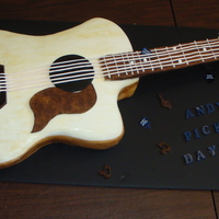 Groom's Guitar Cake The groom played this guitar in a band. It is a yellow cake with buttercream filling. All accents are fondant or gumpaste. The picks are...