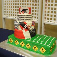 Band Banquet 2010 Chocolate and French vanilla cake with butter cream. 2nd tier is fondant. Accents are fondant and gumpaste. I give myself an A for effort...