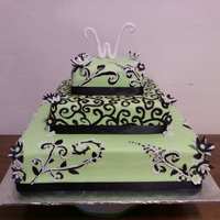 Lime Green & Black Swirls Wedding Cake White cake with MMF covering it. I painted the black swirls with wiltons black gel color. The topper was Wilton fondnat rolled and formed...