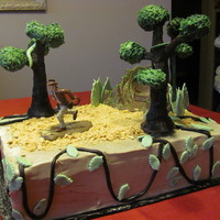 Indiana Jones Is Back Chocolate cake filled with fresh strawberries and strawberry puree. Covered with chocolate buttercream.