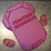 Baby Shower Cake I attended a friend's baby shower on the weekend. I made a babycake shaped as a baby onesie. Flavors are white cake w/ vanilla pudding...