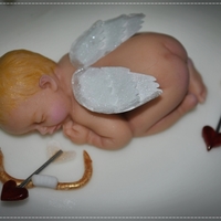 Cupid's Sleeping Another baby made from my First Impressions mold. Made for a Valentine's Day Cake Challenge display table. Everything is edible except...