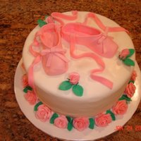 Ballet Slippers This was a birthday cake for a woman who teaches ballet. Slippers and roses made of fondant.