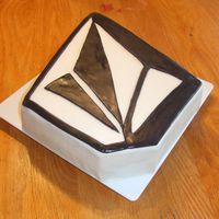 Volcom Logo Cake Lost a bet with my son and his friends. I had to make them a Volcom logo cake. Layer of choc. fudge and layer of yellow with sprinkles in...