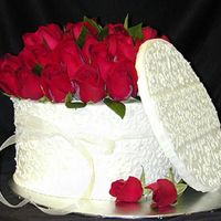 American Beauty Montagne Noire Chocolate cake. iced in Toba Garret's French vanilla butter cream. Natural roses
