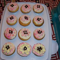 Mothersday Cupcakes these are my lemon cupcakes with lemon curd filling.buttercream frosting.the flowers are made from cut mini marshmallows and chocolate chip...