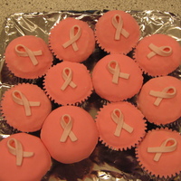 Breast Cancer Cupcakes This is a strawberry cupcakes filled with homeade strawberry mousse filling and pink breast cancer ribbon on top.