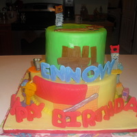 Handy Manny 1St Birthday Cake & Smash Cake Two tier cake with Handy Manny characters made out of fondant. Smash cake with picture of Handy Manny.