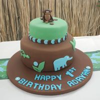 Jungle Themed Birthday Cake This cake was inspired by Alexander Henry's beautiful "zoo" fabric. The monkey took entirely too long to do. I need to get...