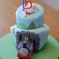 Thomas The Tank Engine Cake Chocolate cake with vanilla SMBC, covered in fondant. My first attempt at a topsy turvy cake. So many things went wrong, so I really have a...