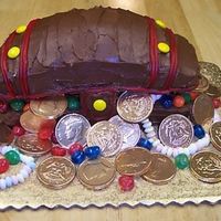 Kenny's 6Th Birthday Cake Again, done by my MIL - good thing he's born in December or I'd have never found the gold/chocolate coins for her.