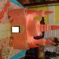 Castle castle is butter-cream icing - turrets are ice cream cones -walkway and door/windows are mmf and tiara is royal icing