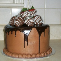 Chocolate And Strawberries This is a yellow cake with milk chocolate icing and chocolate ganache. The strawberries are dipped in milk chocolate and white chocolate...