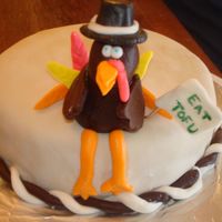 Digital_Camera_Pics_660.jpg I got the idea from the turkey from this website. He is chocolate fondant...that did not turn out well but looks ok in the pic. The cake is...