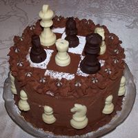 Chess Cake Done as an emergency cake in my MIL's kitchen, with no equipment whatsoever (no spatulas, no turntable, no piping bag - nothing). Good...