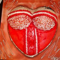 Bustier Cake Made for a co-worker's boyfriend yellow heart shaped cake with sports ball top airbrushed white fondant. Inspired by a cake I saw here...