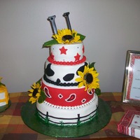 Horse Lover's Birthday Cake cake done in bc and fondant. cow spots in fondant, bandana in fondant with bc accents, fondant fence, artificial sunflowers, and "...