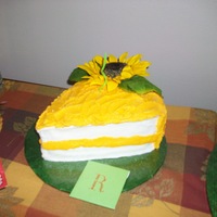 Sunflower Slice Of Cake cake done in bc icing. artificial sunflower. 2 ~8" rounds carved.