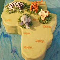 Africa Cake Africa shaped cake with a handmade elephant, monkey, zebra and giraffe.