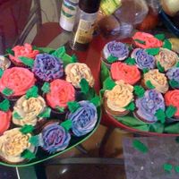 Cupcake Bouquet These are Hazelnut Chocolate cupcakes, with Wiltons recipe for BC frosting..They came out so yummy. Made for a friend who ordered them for...