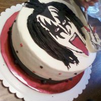Gene Simmons Birthday Cake This is a birthday cake my mom and I made for a friends birthday. Its a round cake with buttercream frosting, and a Gene Simmons transfer...