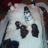 Penguin Igloo Cake This is my larger version of the igloo cake. The characters are all fondant, as well as the igloo covering. The rest is RI. My nephew...