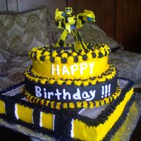 Transformer Bumblebee All buttercream n various layers of chocolate and vanilla cake. Silver Luster Dust was used on top of the open flat surfaces. Bumble...