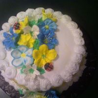 Flowers Vanilla cake with apricot filling and princess cake buttercream icing. There's a quick basket weave on the side. Flowers are royal...