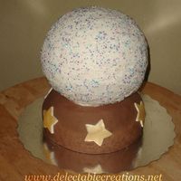 Crystal Ball Fondant bottom, buttercream sports ball on top. Cake is banana with chocolate ganache.