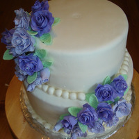 White Fondant Wedding Cake White fondant, gumpaste roses.