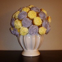 Cupcake Bouquet This was fun. Just cupcakes attached to a styro-foam ball with toothpicks.