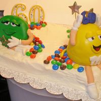 M&m Cake 60th Birthday cake for my wonderful mother-in-law. The M&M's are marshmallow fondant on carrot cake with creamcheese frosting, her...