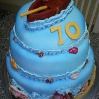 Fishing Cake Made for a 70th birthday. fish and cake a fondant. Boat is gumpaste. shells are molded chocolate and rocks are chocolate rocks from wegmans...